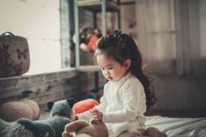 cute girl with toys